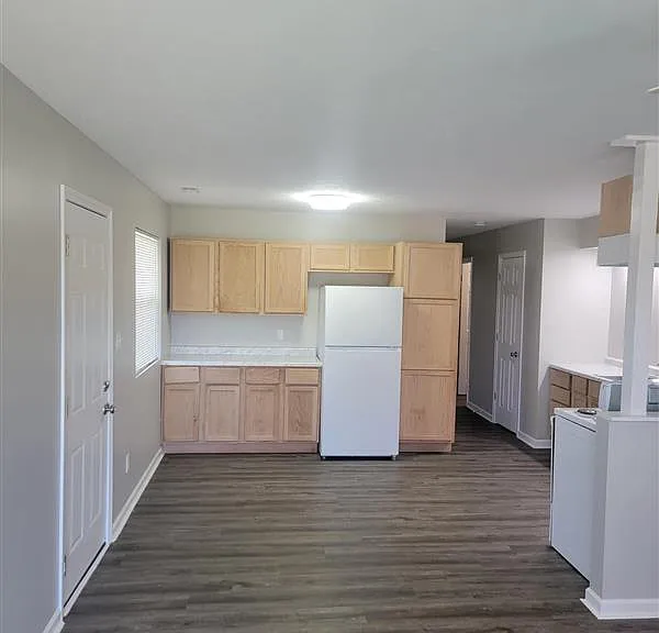 Bright walk in Kitchen space with new appliances Fridge and stove