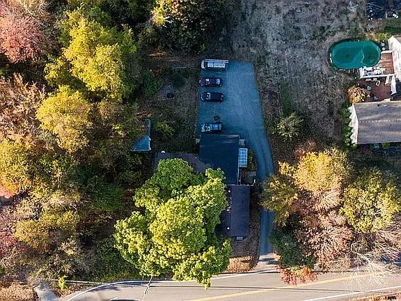 Large private parking area with yard & gardens