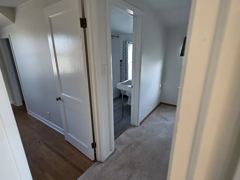 Upstairs hallway showcasing Upstairs Bedroom 1 and Bathroom