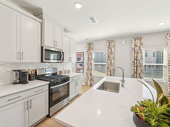 Kitchen in the Jade floorplan at a Meritage Homes community in Mebane, NC.
