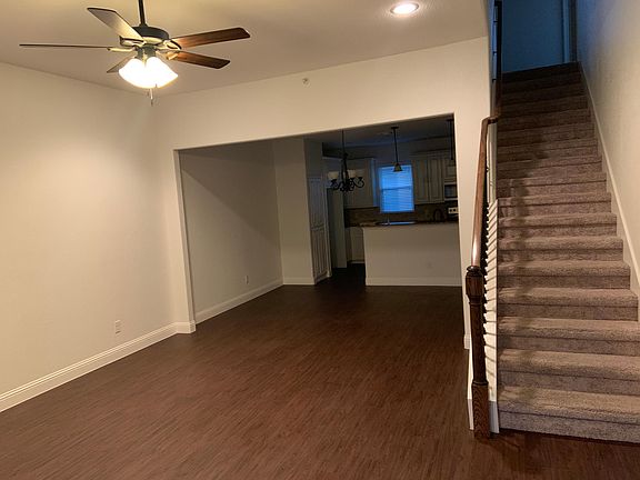 View from living room into kitchen and stairs