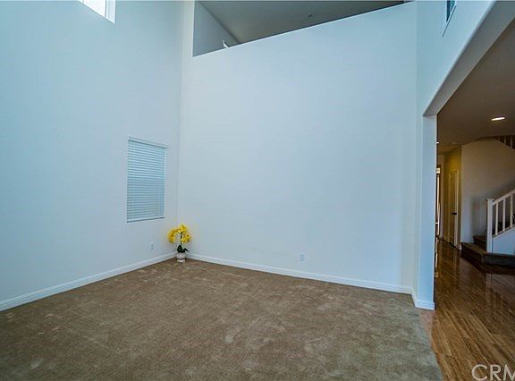 Formal Living Room With 2-Story Ceiling