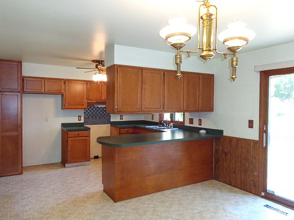 Additional view of kitchen from dining area.