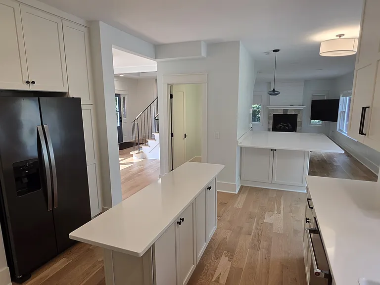 Kitchen with view through dining room and into living area. Notice both islands.