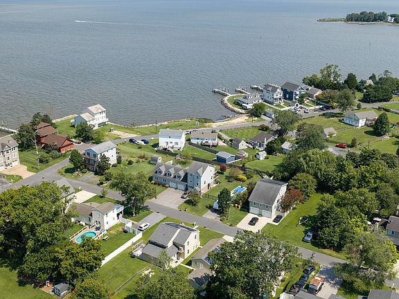 House bottom center facing the private beach for the community.
