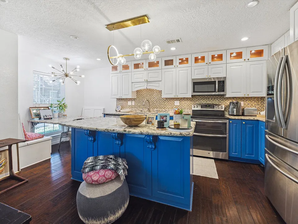 View of the kitchen from the living room, showcasing the open-concept layout