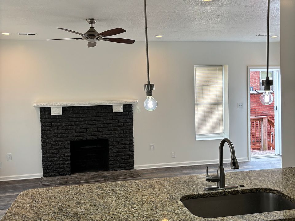 Open concept with view of your fireplace and kids playing around the hearth