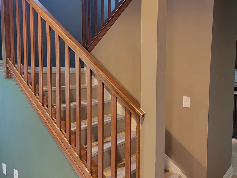 Bright staircase with natural skylight.