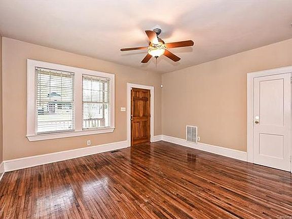 Large, well-lit living room. Storage closet adjacent to the front door