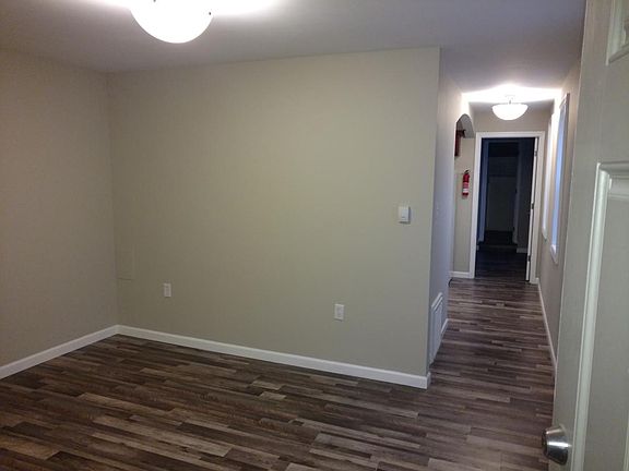 View of living room and hallway to kitchen