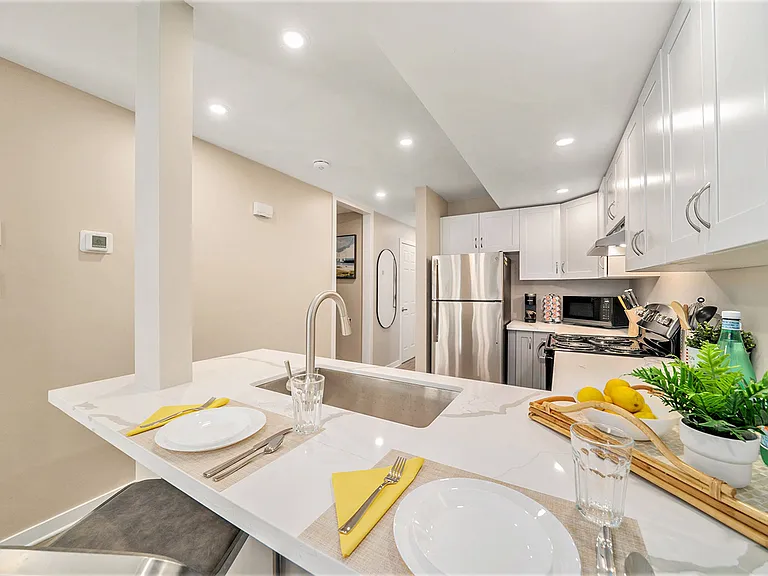 Bright dining space set up for meals in our comfortable, modern Ottawa furnished rental.