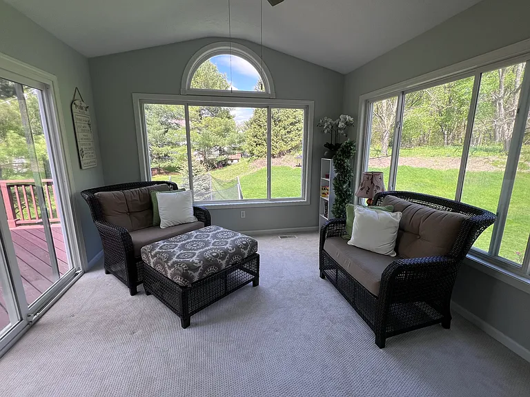 Sun room with a view of the beautiful private backyard