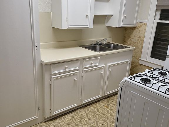 Kitchen with large pantry.