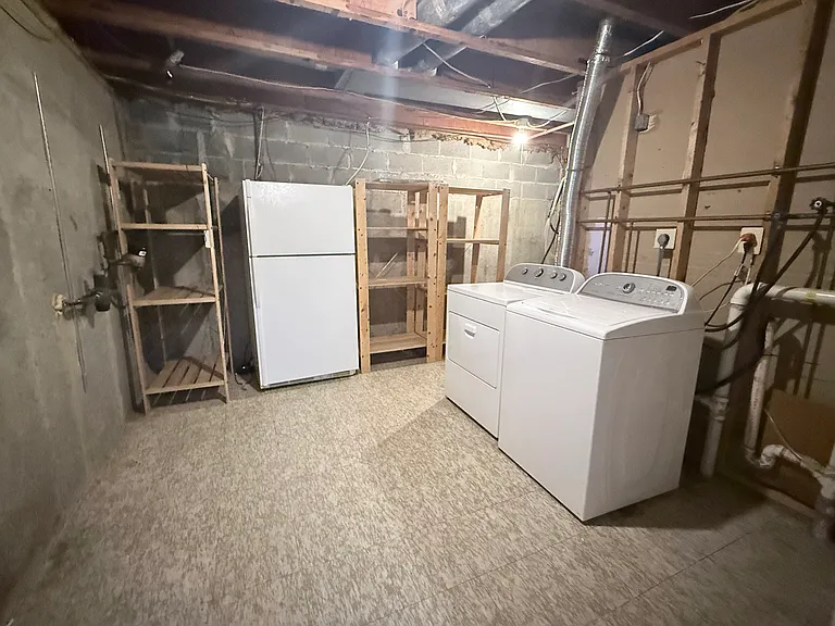 Full washer and dryer and spare refrigerator in the basement