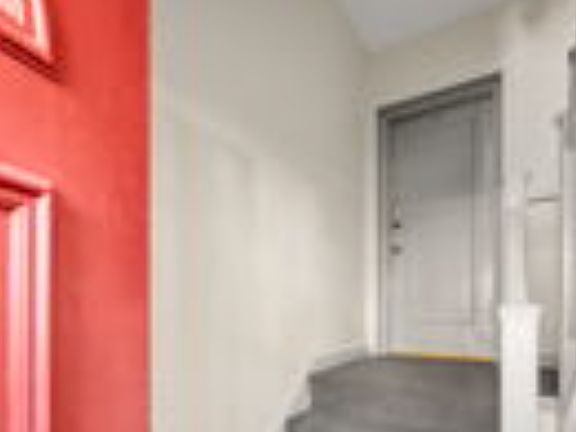 Main building entry includes intercom and a few short steps to condo door.