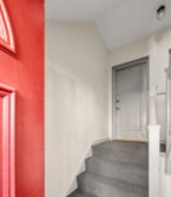 Main building entry includes intercom and a few short steps to condo door.