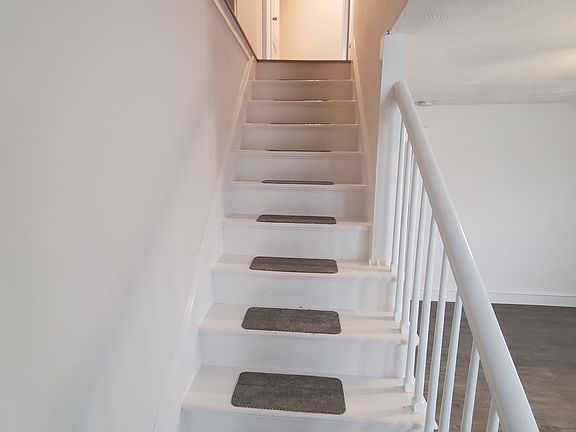 Stairs to access bedrooms inside the apartment.
