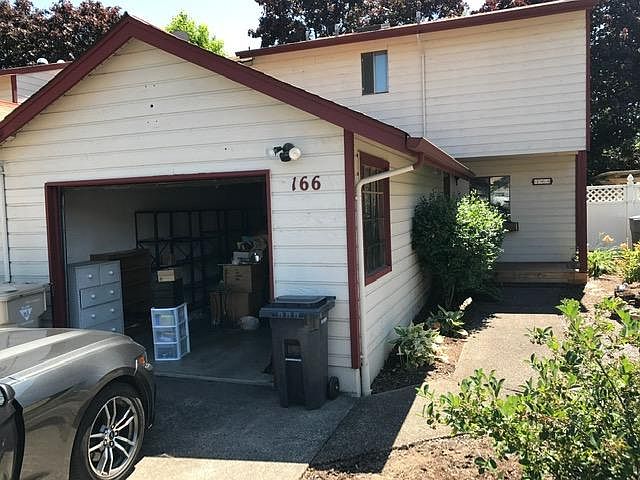 One car garage and driveway space. Landscaping maintained by owner.