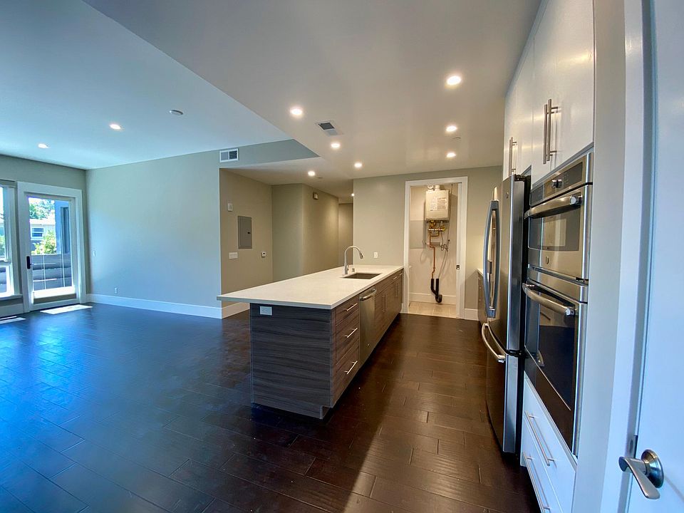 Kitchen with Breakfast Bar + Open Living Space