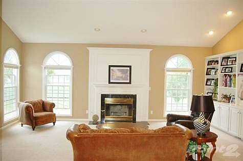 Living Room includes wood burning fireplace, built-ins.