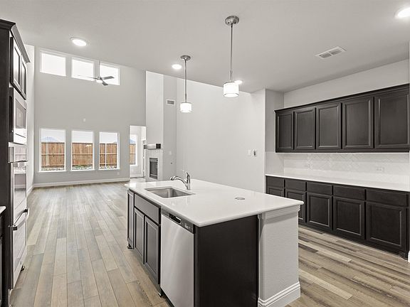 Fairmont floor plan by Pacesetter Homes featuring a first-floor primary suite, open-concept kitchen
