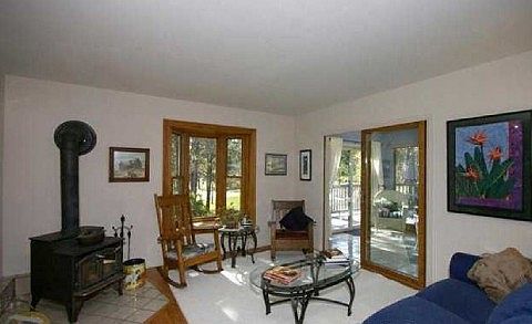 Open and bright with main level wood burning stove