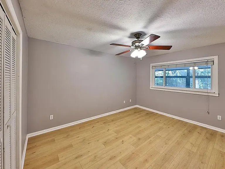 Bedroom with updated paint and new laminate flooring