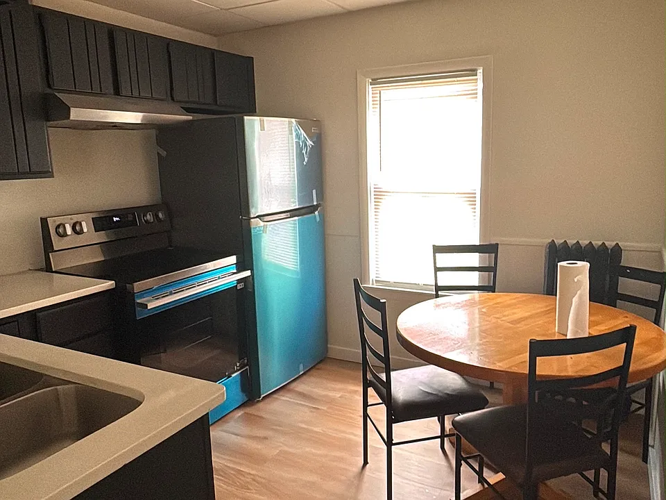 kitchen with new appliances and table