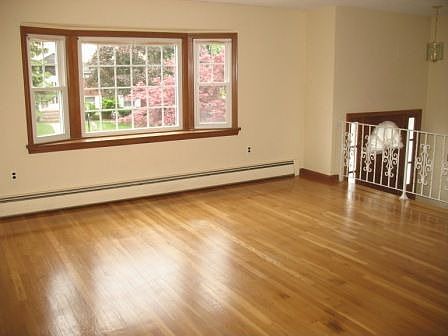 Living Room - sunny bay window overlooks gorgeous Japanese Maple