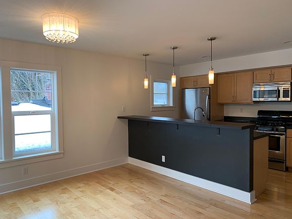 Breakfast bar and dining area with space for a large table.