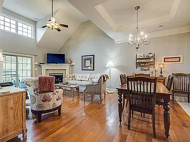 Open Concept Living Room with Cathedral Ceiling, Dining Room and Fireplace