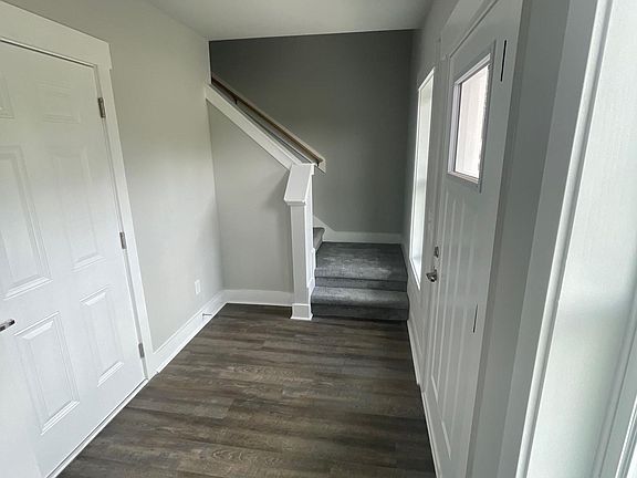 First floor: Garage door entrance on left, picture standing in laundry area