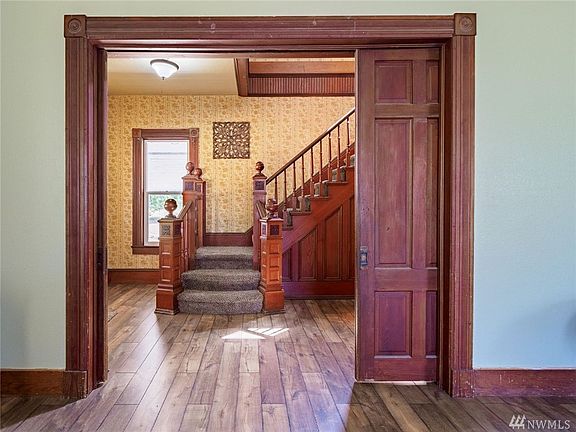 The living room has two sets of the these pocket doors, be sure to open to see their glory