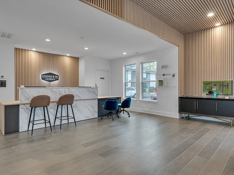 Step into modern living at Crossings @ 501 Apartments. This inviting lobby features stylish seating and contemporary design, perfect for welcoming guests or unwinding after a long day. Schedule a visit today and see it for yourself!