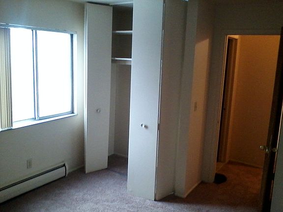 Bedroom fits a king-sized mattress with bedside table and ro
