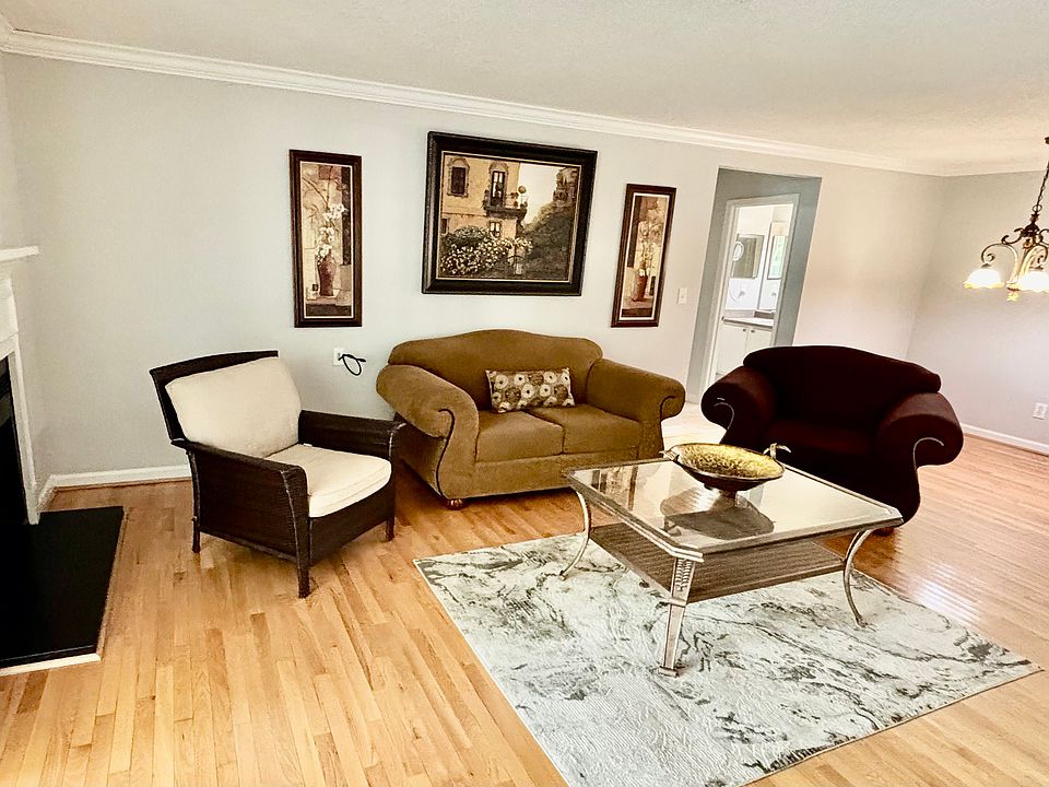 Open living and dining area with fireplace