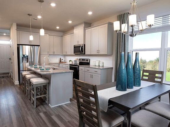 The stunning kitchen features easy access to the great room and dining area.