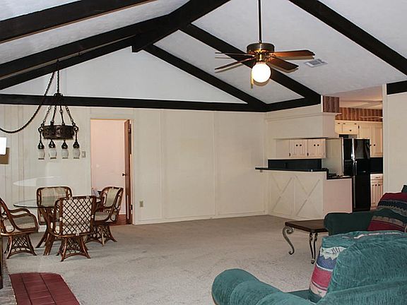 Huge open living room, vaulted ceilings and impressive, dark wood beams that add so much character!