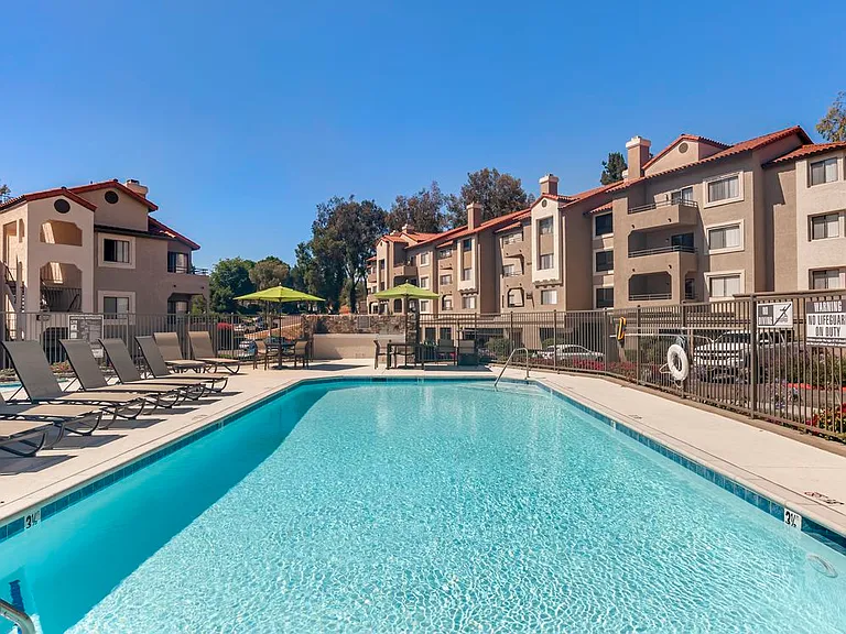 Swimming pool and sundeck with lounge seating