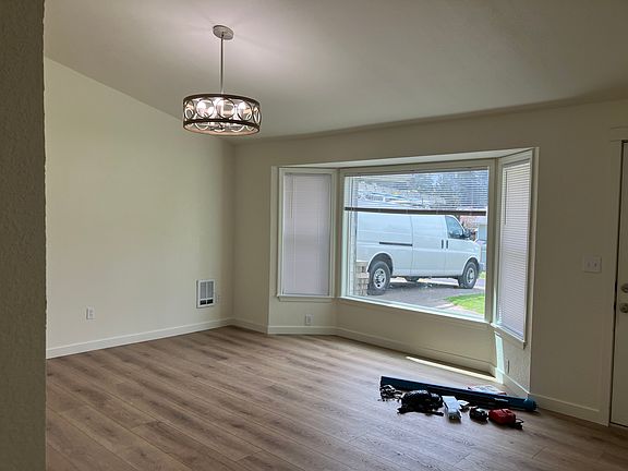 Front living room is large and bright. All new flooring throughout.