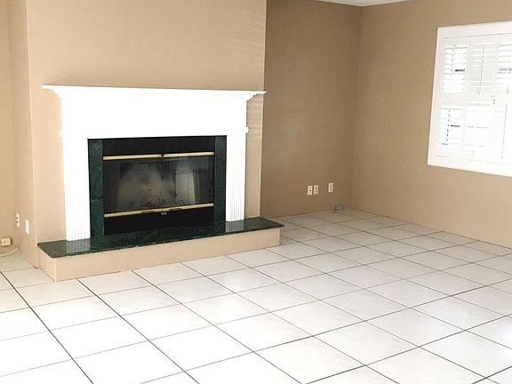 Family room with rare wood burning fireplace