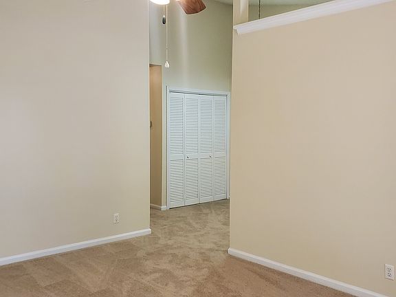 Living Room with arched ceiling, patio off sliding door to right