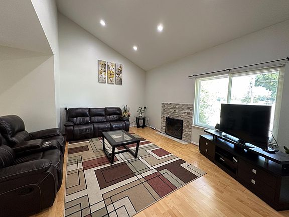 Living room with high ceilings and big windows