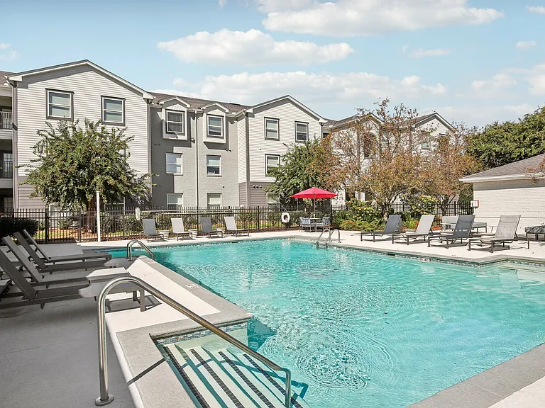 Unwind by the outdoor pool with comfortable lounge chairs and shaded seating at The Preserve Murfreesboro.
