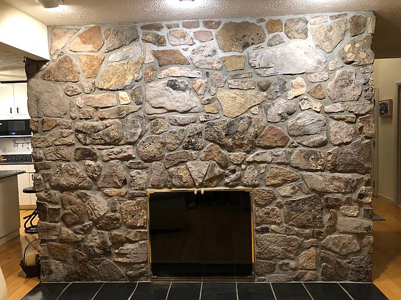 Walk-around stone fireplace.