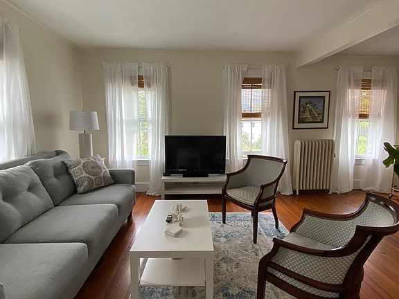 Living room with smart TV and Internet. Super comfy long couch for great relaxation.