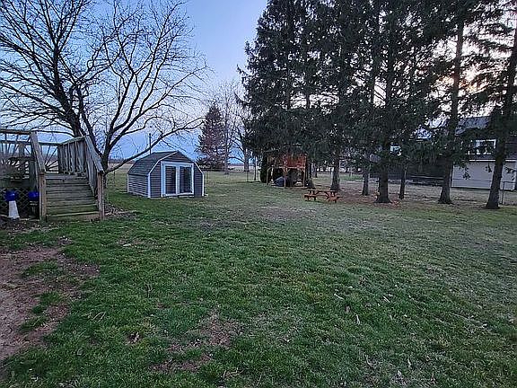 Large yard with mature trees