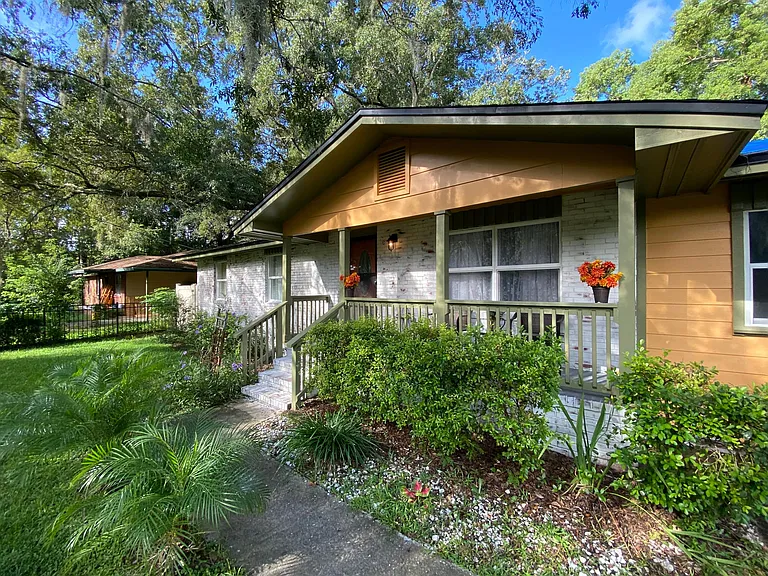 front of house with small covered porch