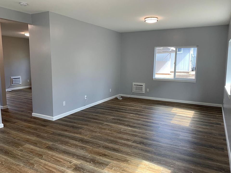 Large living space with plenty of natural light shining through. Could be used as an office, bedroom, exercise room, or all of the above!