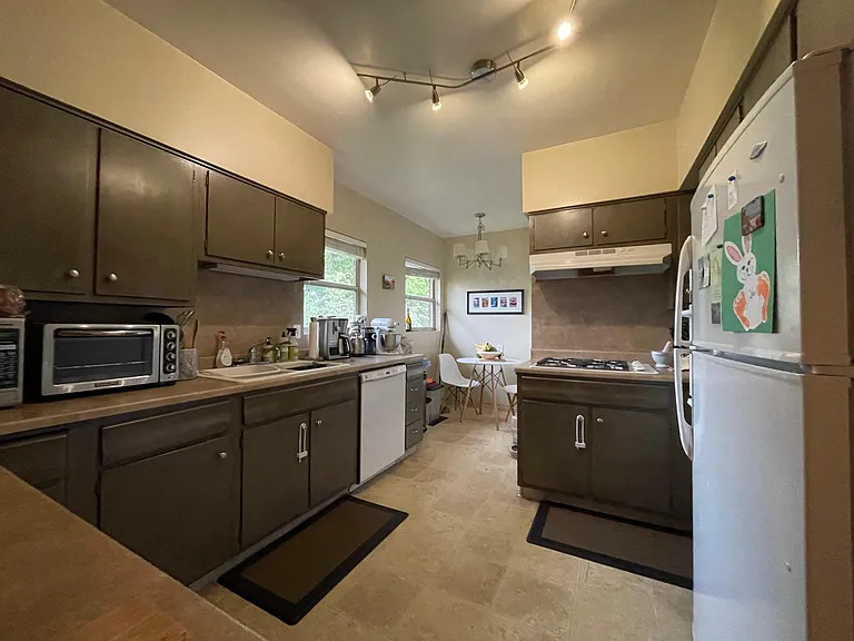 Eat-in kitchen with gas stove.